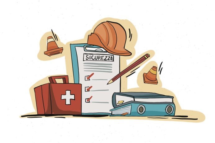 Elementi di sicurezza sul lavoro come casco e kit di pronto soccorso